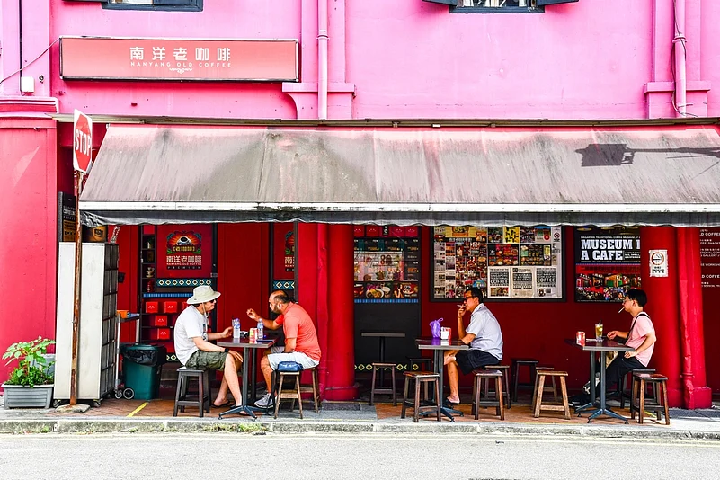 People having a drink at a cafe in Chinatown, Singapore